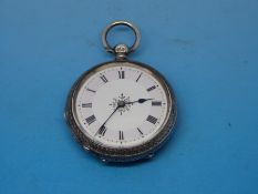 A hallmarked silver cased watch with engraved floral decoration
