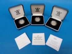 Three cased £1 silver coins with certificates for 1993, 1998,
