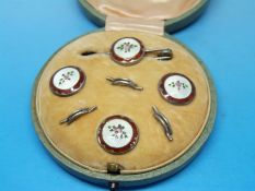 A set of silver studs and a brooch decorated with guilloché enamel,