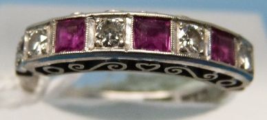 An 18ct gold ring set with alternating diamonds and rubies in square setting (size L)