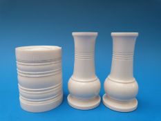 A pair of turned ivory vases and a turned ivory pot