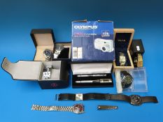 A collection of watches and a camera