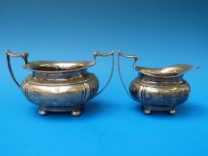 A hallmarked silver sugar bowl and milk jug (272g)