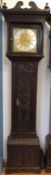 A late 18thC heavily carved long cased clock with a 30 hour movement,