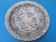 A large Chinese blue and white dish with pond scene to centre in the Ming style (8.