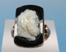A 9ct gold ring set with a hardstone cameo in a textured setting (size O), 1.9cm, 1.