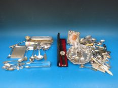 A hallmarked silver cigarette case, quantity of hallmarked silver cutlery and a shot measure,