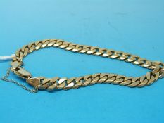 A yellow metal bracelet of flattened links stamped 14k (22.