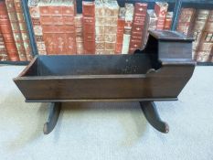 A 19thC apprentice mahogany rocking crib,