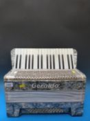 A 1930s Geraldo 36 bass piano accordion,
