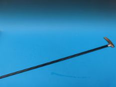 A rhinoceros horn handled walking stick with a silver collar (B'ham 1901)