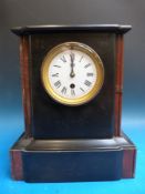 A Victorian slate mantel timepiece with red marble decoration to case,