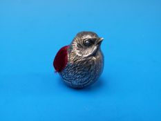 A silver pin cushion in the form of a hatching chick by Sampson Mordan, Chester, 1911,
