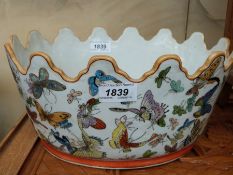 A Chinese planter with scalloped edge and lion mask handles