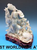 A Chinese jadeite carving of a female figure and a toad, faint brown inclusions,