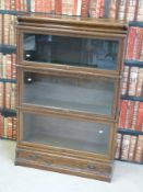 A three-tier oak Globe Wernicke style bookcase (W86 x D31 x L130cm)