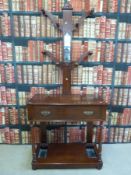 A late 19th/ early 20th century hall stand, with hanging pegs and mirror to top,