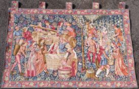 A Flemish style tapestry with traditional wine making scene