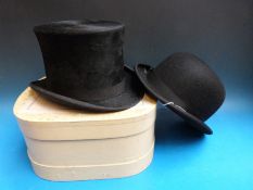 An adjustable spring brim 'Wyanco' silk top hat in London retailers box together with a bowler hat