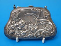 A boxed hallmarked silver Art Nouveau embossed purse, Chester 1906,
