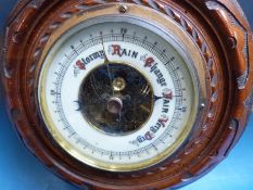 Two small early 20thC carved aneroid barometers