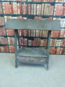 A country house style saddle horse with drawer below,