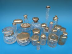 Twenty one various hallmarked silver mounted dressing table bottles,