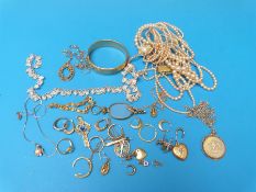 A collection of yellow metal and gold earrings and pendants, white metal filigree necklace,