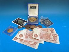 A mounted silver medal coin commemorating the Queen's Silver Jubilee 1952-77 together with a