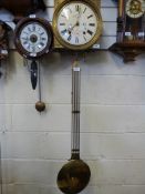 An early 19thC French chiming comptoise wall clock with lyre pendulum and hand painted floral