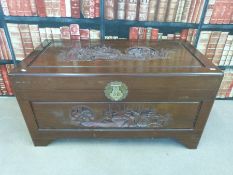 A large camphor wood chest with carved front and top (W46 x W102  x H46 x D47)