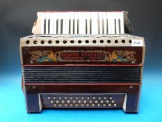 A c1918 Cesare Pancotti 36 bass piano accordion in wood finish,