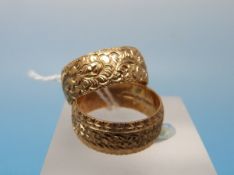 Two 9ct gold wedding bands with textured finish (6.