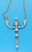 A yellow metal necklace marked 15ct set with seed pearls