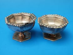 A pair of hallmarked silver octagonal salts together with a pair of hexagonal salts with gilt