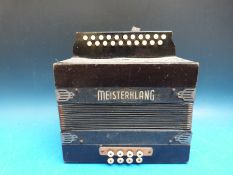 A vintage two row melodeon with name plate Ferdinand Moser,