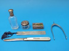 A hallmarked silver bookmark, pair of silver sugar nips formed as a wishbone,