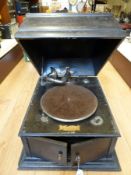 An Academy vintage wind up gramophone with retailer's mark for F W Dunkley,