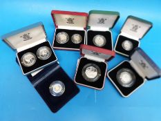 A collection of cased silver Piedfort coins comprising 50p, 20p, 10p,