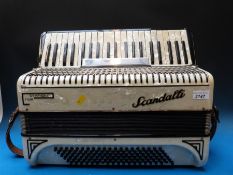 A c1950 Scandalli symphony Four 120 bass piano accordion,