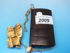 A Japanese four way inro with ivory ojime bead and figural netsuke