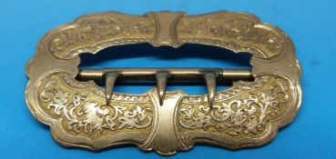 A yellow metal buckle engraved 1890 verso with engraved floral design to the front