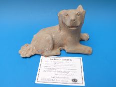 A Chinese pottery dog with certificate purporting Han Dynasty,