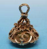 A 9ct gold charm/watch fob set with a yellow stone