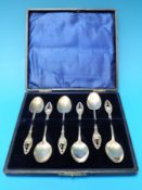 A set of six silver spoons with pierced swan finials (B'ham 1909,