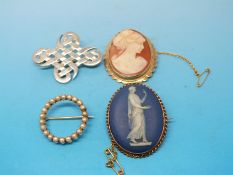 A  yellow metal brooch marked 15ct set with seed pearls,