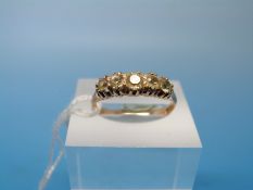 A Victorian 18ct gold Victorian ring set with five graduating diamonds (size N)