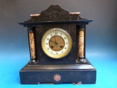 A Victorian French black slate mantel clock,