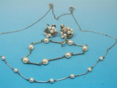 A silver and pearl suite of jewellery comprising necklace,