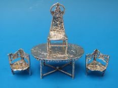 Four pieces of Dutch silver dolls house furniture, each with Dutch marks and import marks,